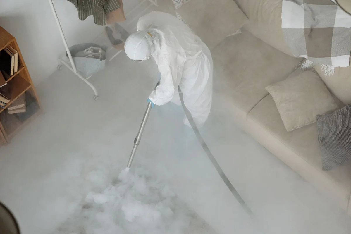 Biohazard cleanup technician in protective equipment, Davenport Ranch, Austin, TX